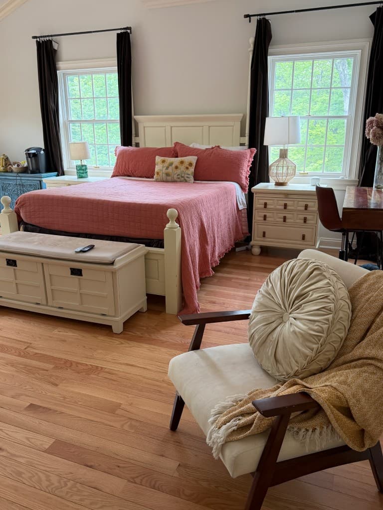 Serene bedroom with premium bedding and woodland views